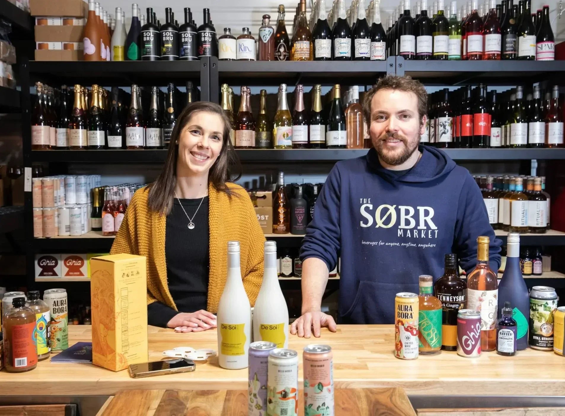 Søbr Market founders Shane and Jessie Halliburton inside their Winnipeg non-alcoholic beverage shop.